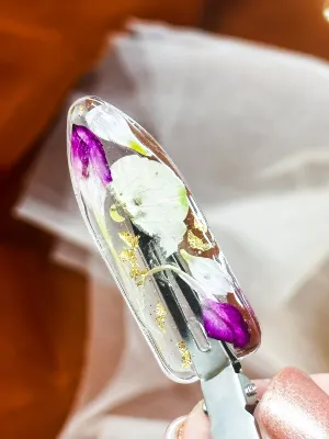 Clear No dent resin clip with Real Pink and White Toned Flowers Cast Inside.