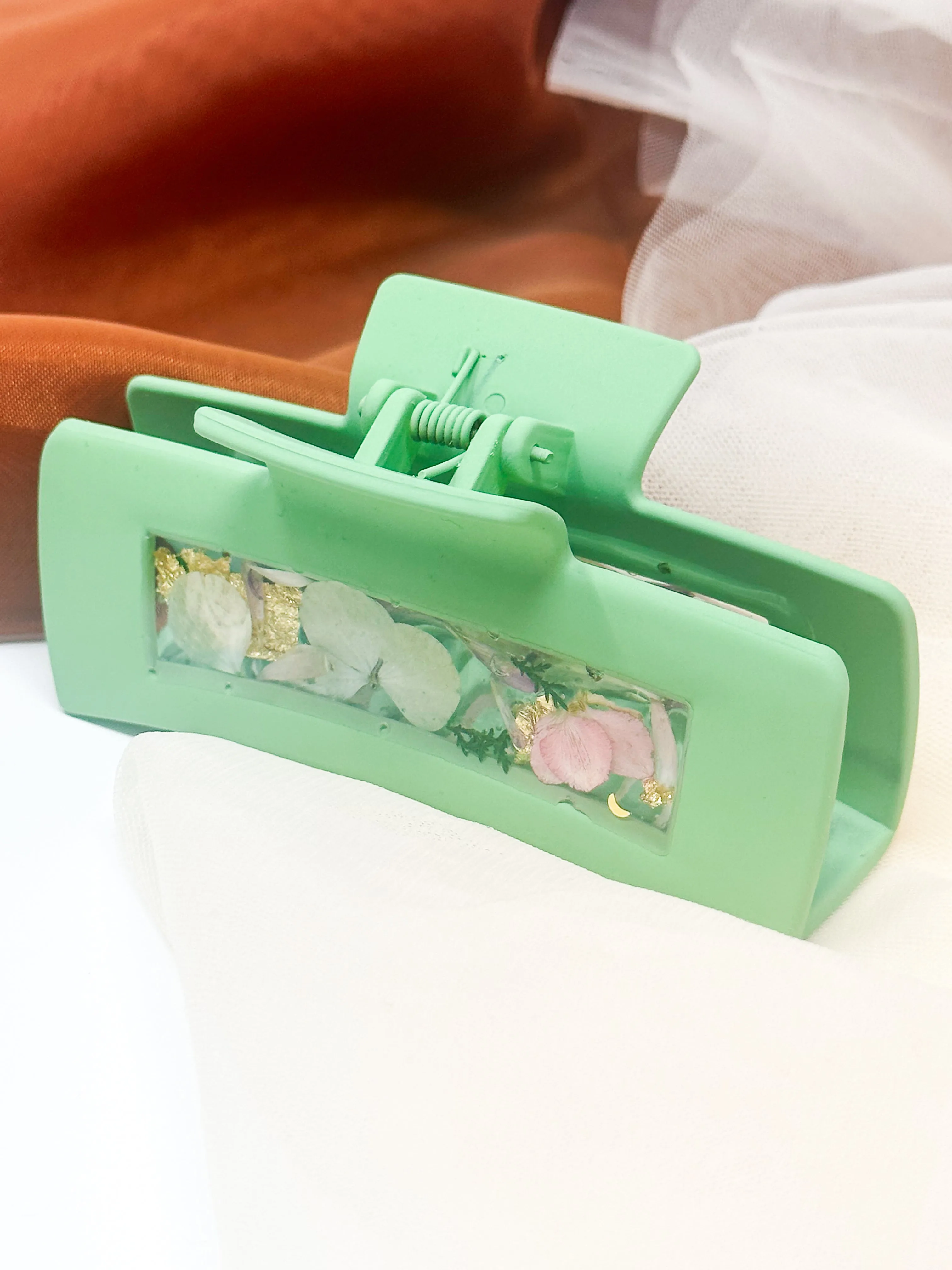 Pastel Green Claw Clip Infused with Real Flowers in Resin.