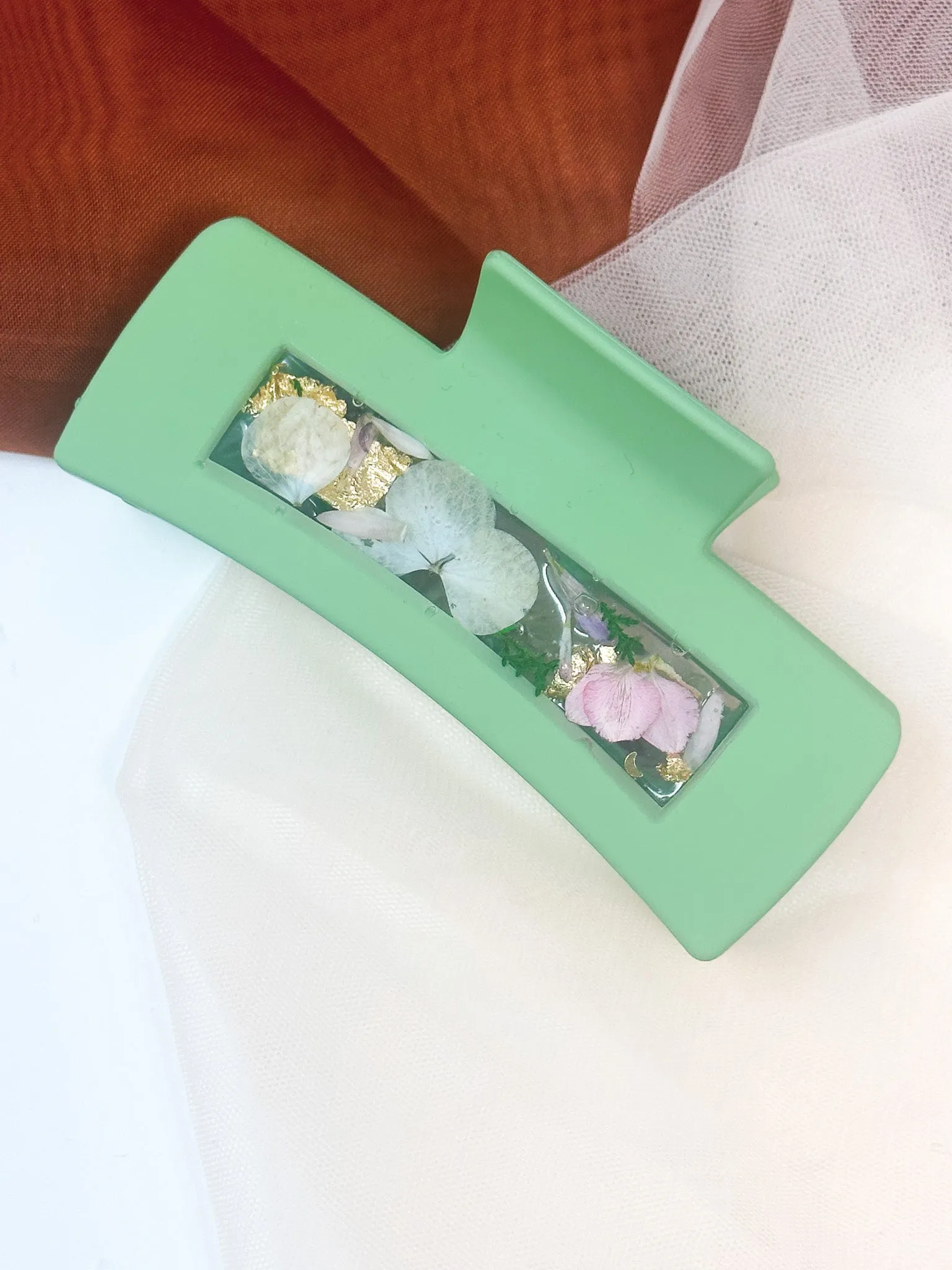 Pastel Green Claw Clip Infused with Real Flowers in Resin.