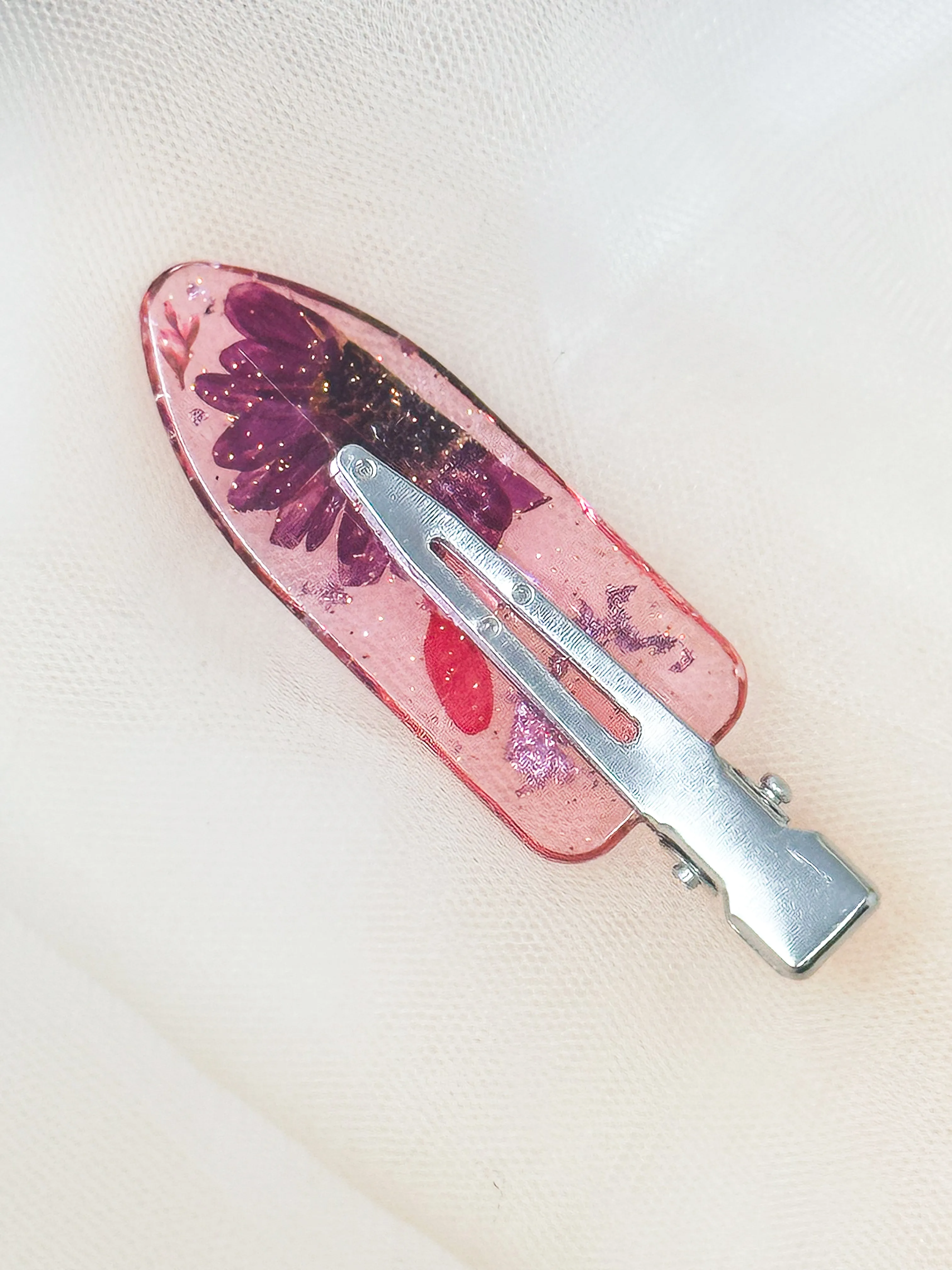 Pink No dent resin clip with Real Pink and Magenta Toned Flowers Cast Inside.